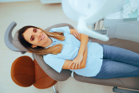 Woman smiling while relaxing in treatment chair