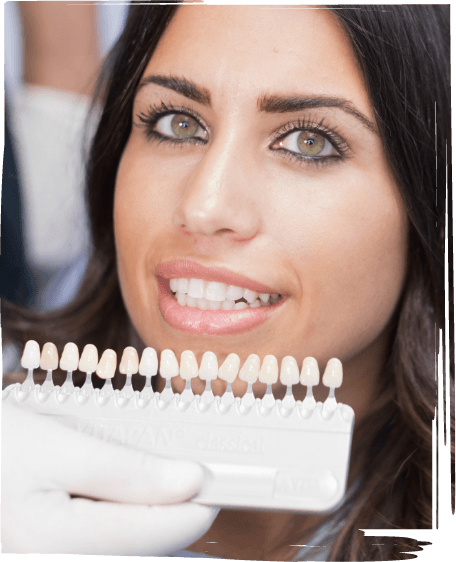 Woman receiving dental veneers from her cosmetic dentist in Worcester