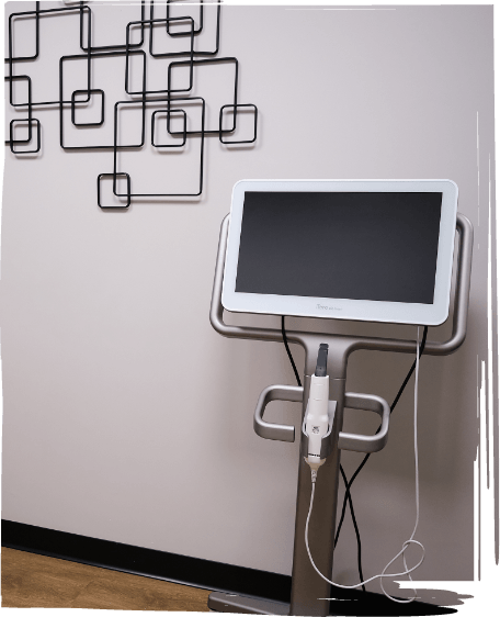 Dentist taking digital impressions of a patients teeth