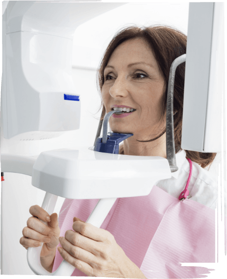 Woman getting C T cone beam scan of her mouth