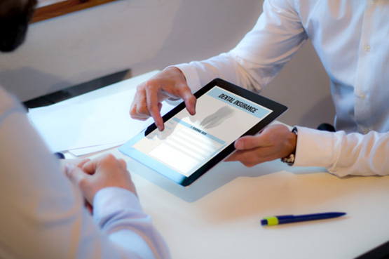 Patient reviewing dental insurance on tablet