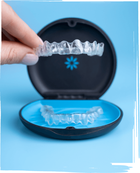 Hand putting an Invisalign clear aligner in Worcester into its storage case