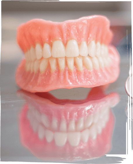 Full dentures resting on table