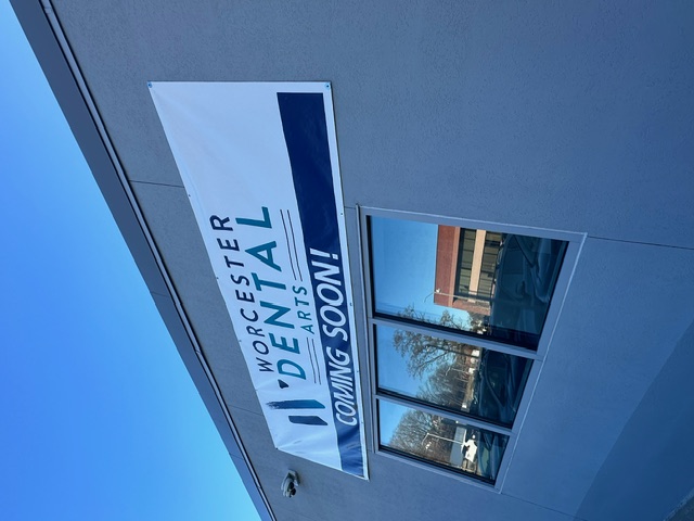 Sign outside of building that reads Worcester Dental Arts Coming Soon
