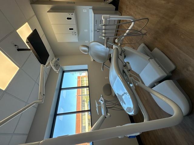 Dental exam chair next to a window