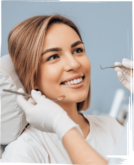 Woman smiling at her dentist during preventive dentistry checkup