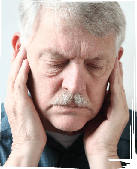 Man holding his temples in pain