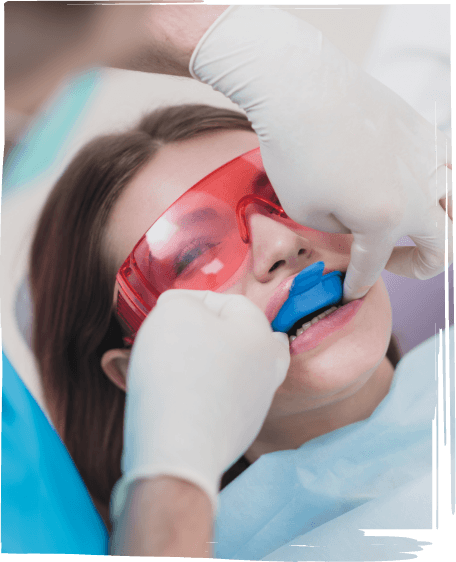 Dental patient having fluoride applied to their teeth