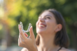 a patient with Invisalign smiling 